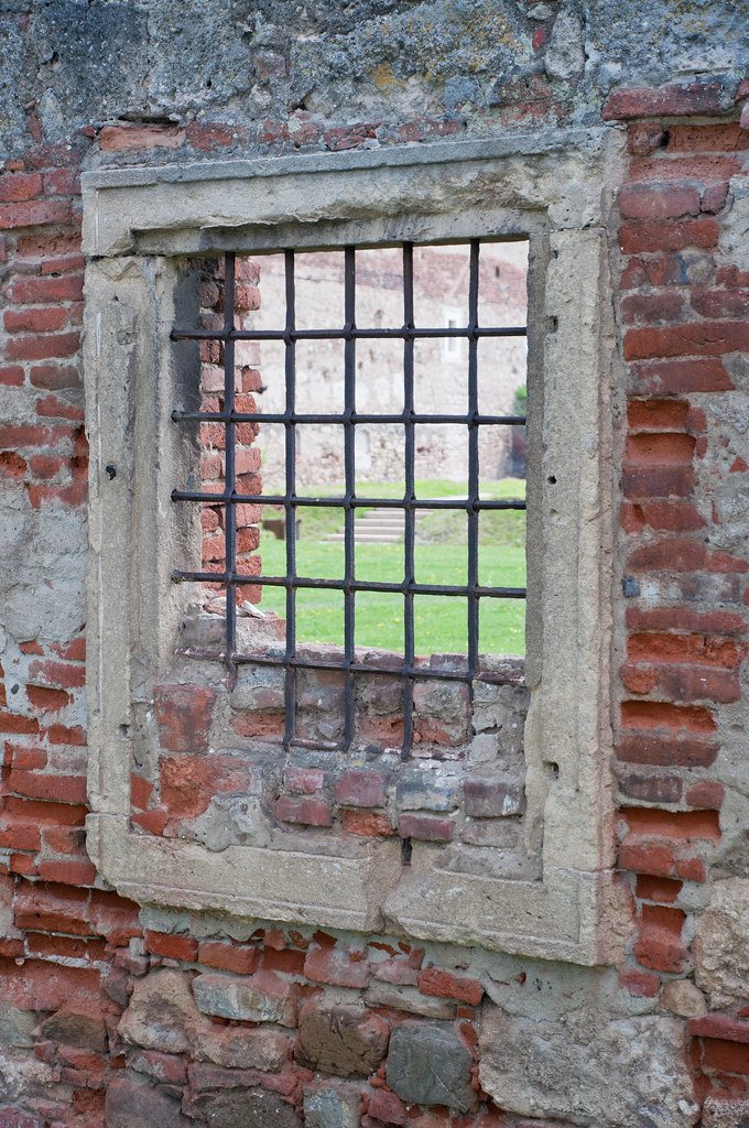 Granite window frame with stone surround